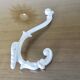 Pair of Art Deco white cast iron coat hooks from the 1930s and 1940s