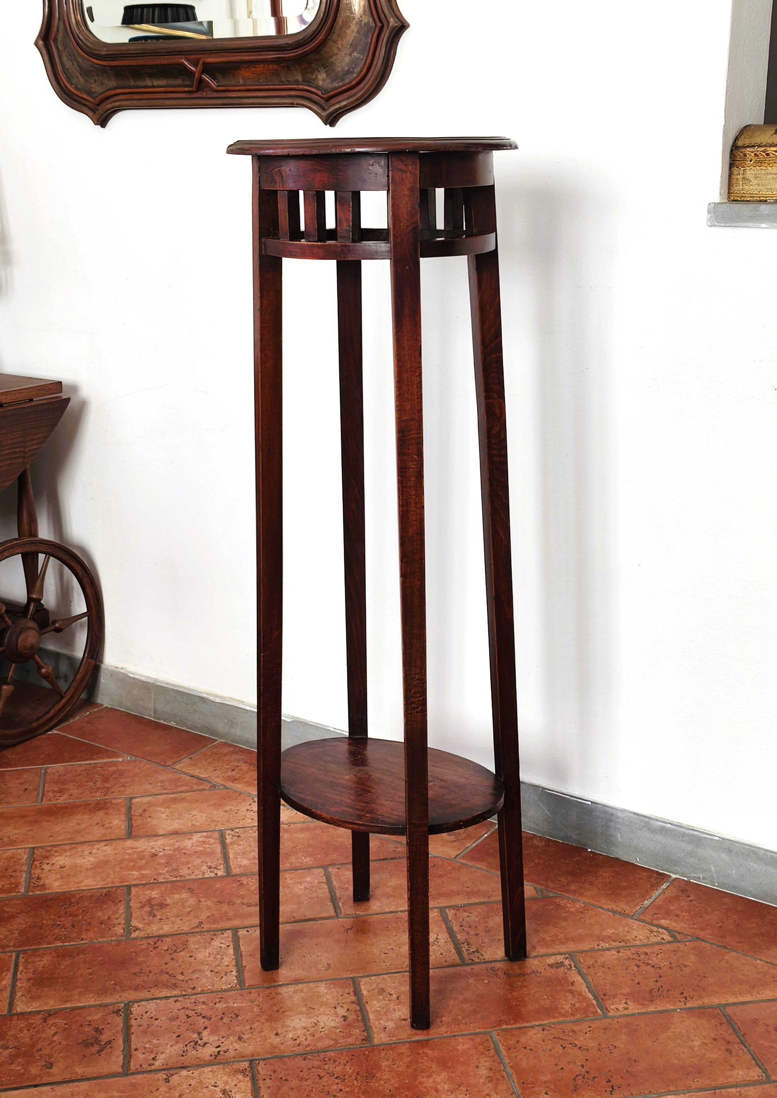 Antique high wooden pedestal with mahogany patina, circa 1900-1925.