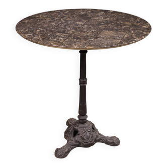 20th-century French iron bistro table with a marble top.