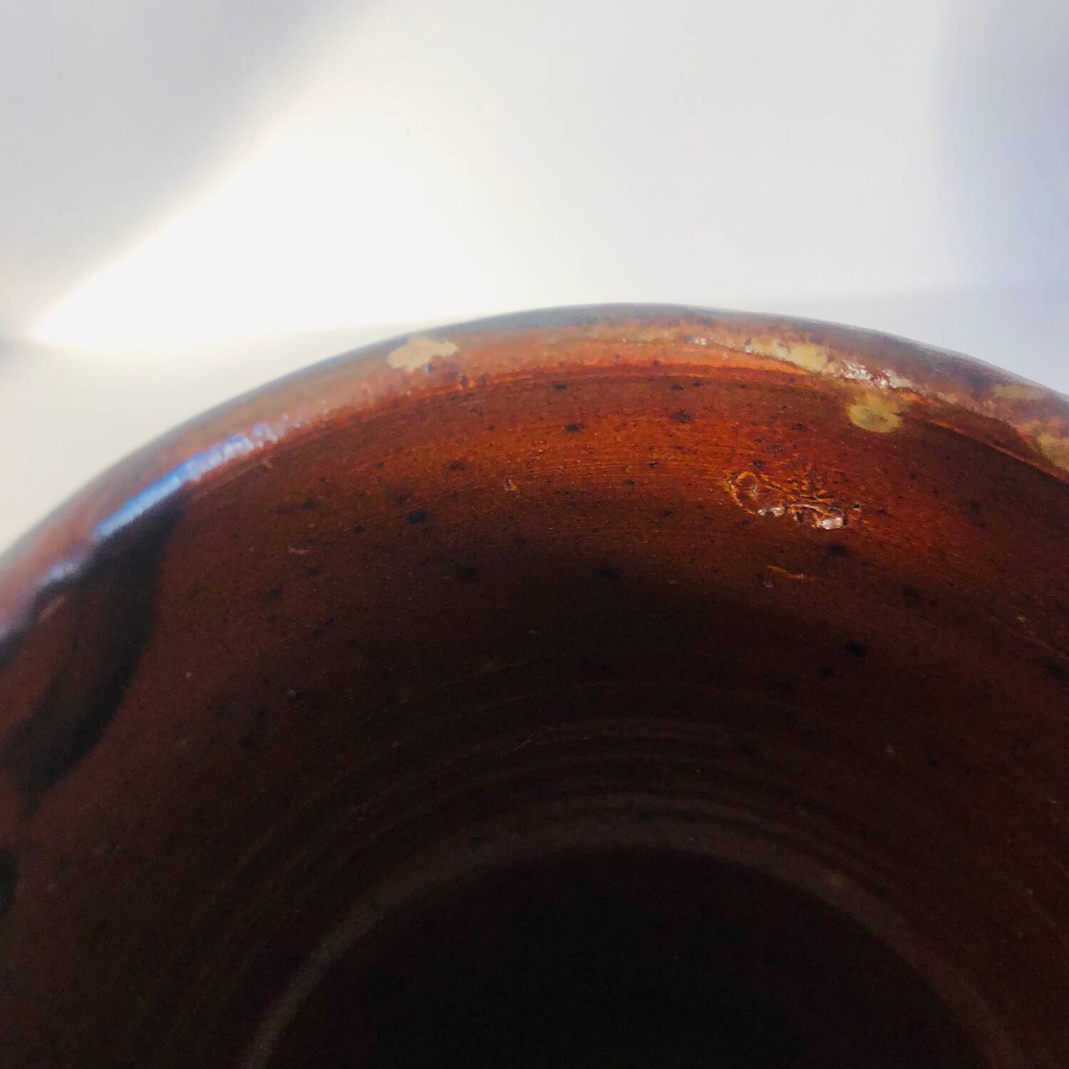 Metallic brown ceramic torso vase