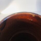 Metallic brown ceramic torso vase