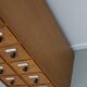 German Oak Apothecary Cabinet with Enamel Shields, 1940s