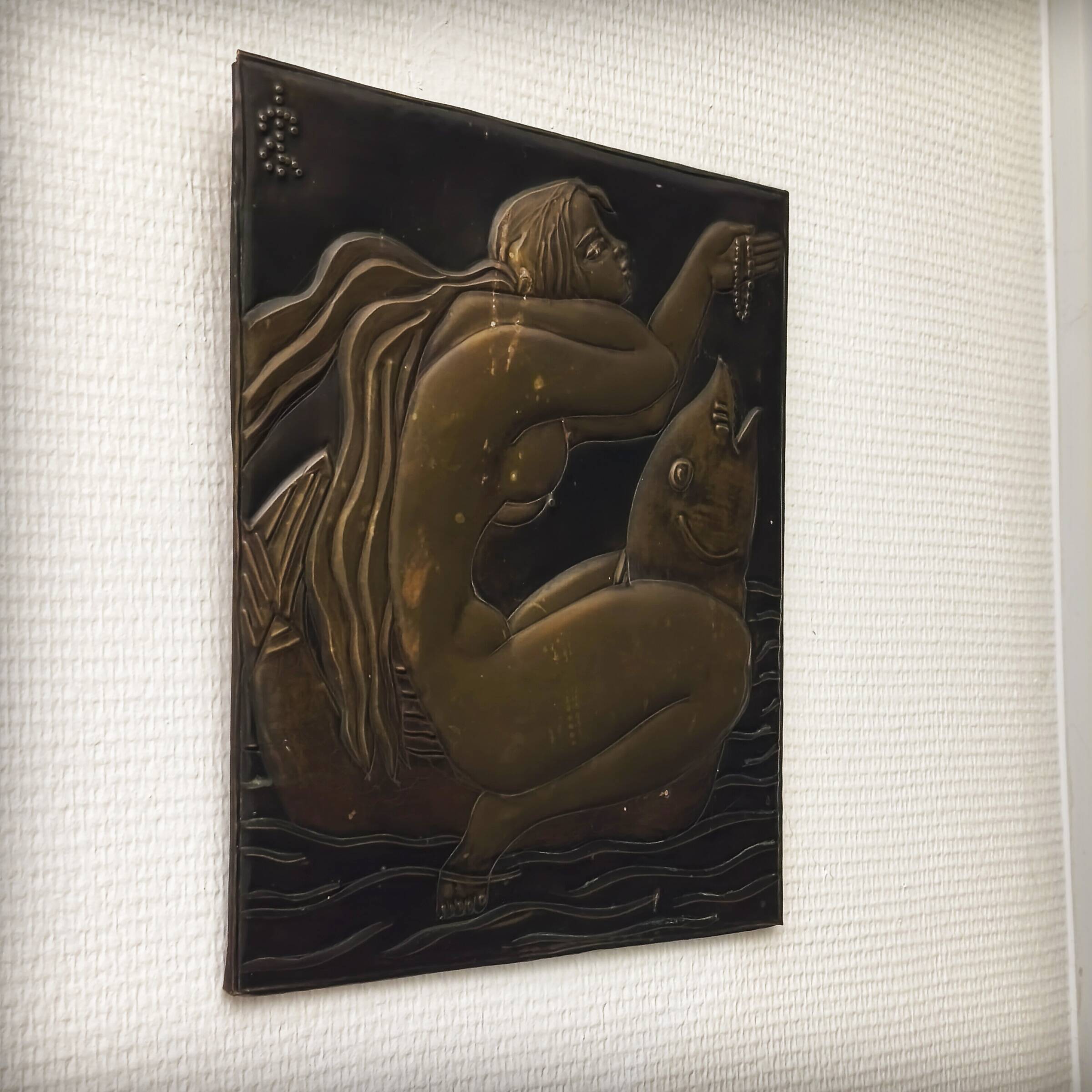 Brass table featuring a woman and a dolphin, France, 1960s.