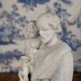 Statue of Saint Joseph and the infant Jesus in biscuit porcelain, early 20th century