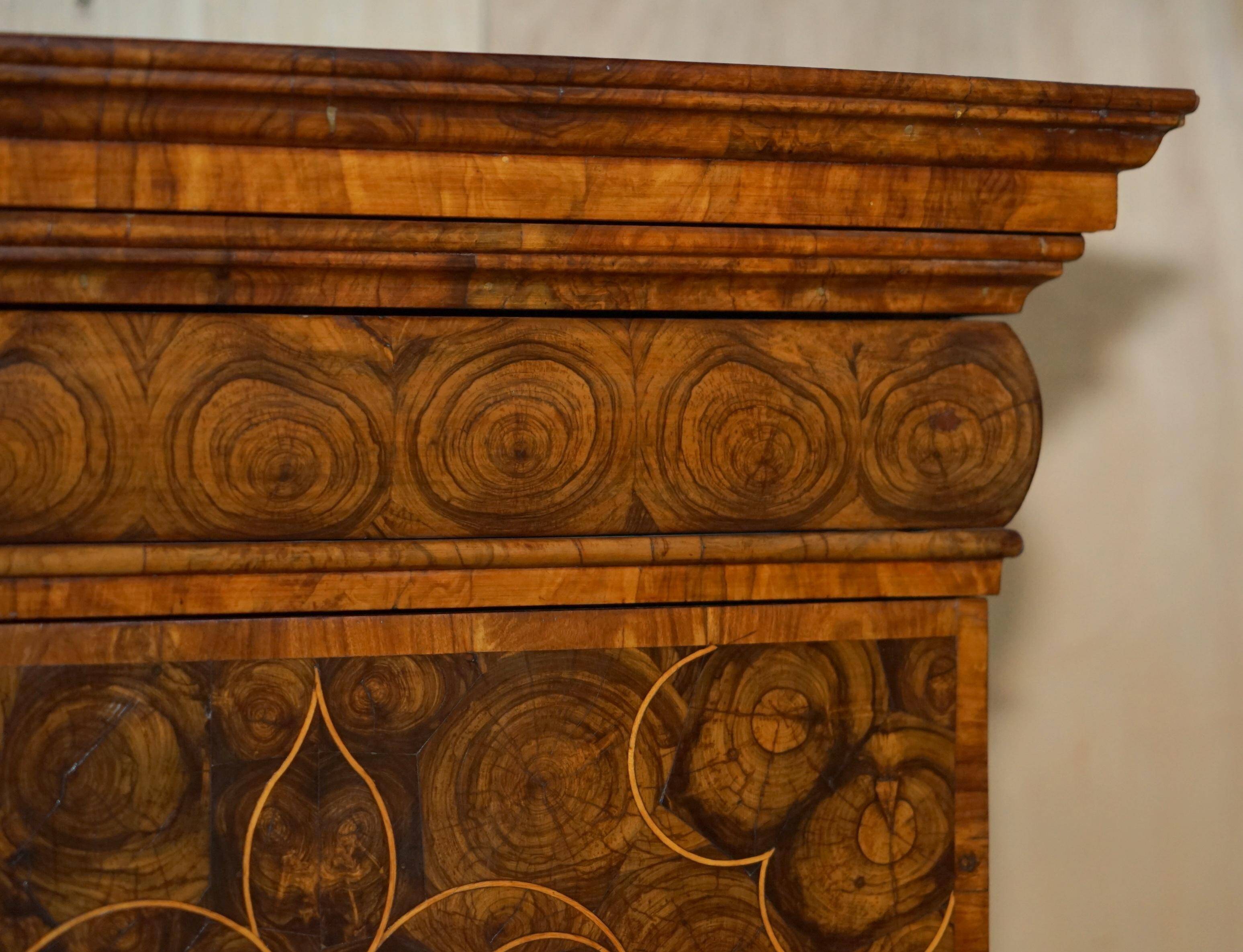 Queen Anne style pedestal commode from around 1710 in walnut and oyster veneer.