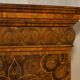 Queen Anne style pedestal commode from around 1710 in walnut and oyster veneer.