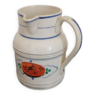 Old earthenware pourer with blue edging decoration