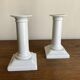 Pair of neo-classical Empire candlesticks from the late 19th century in white porcelain.