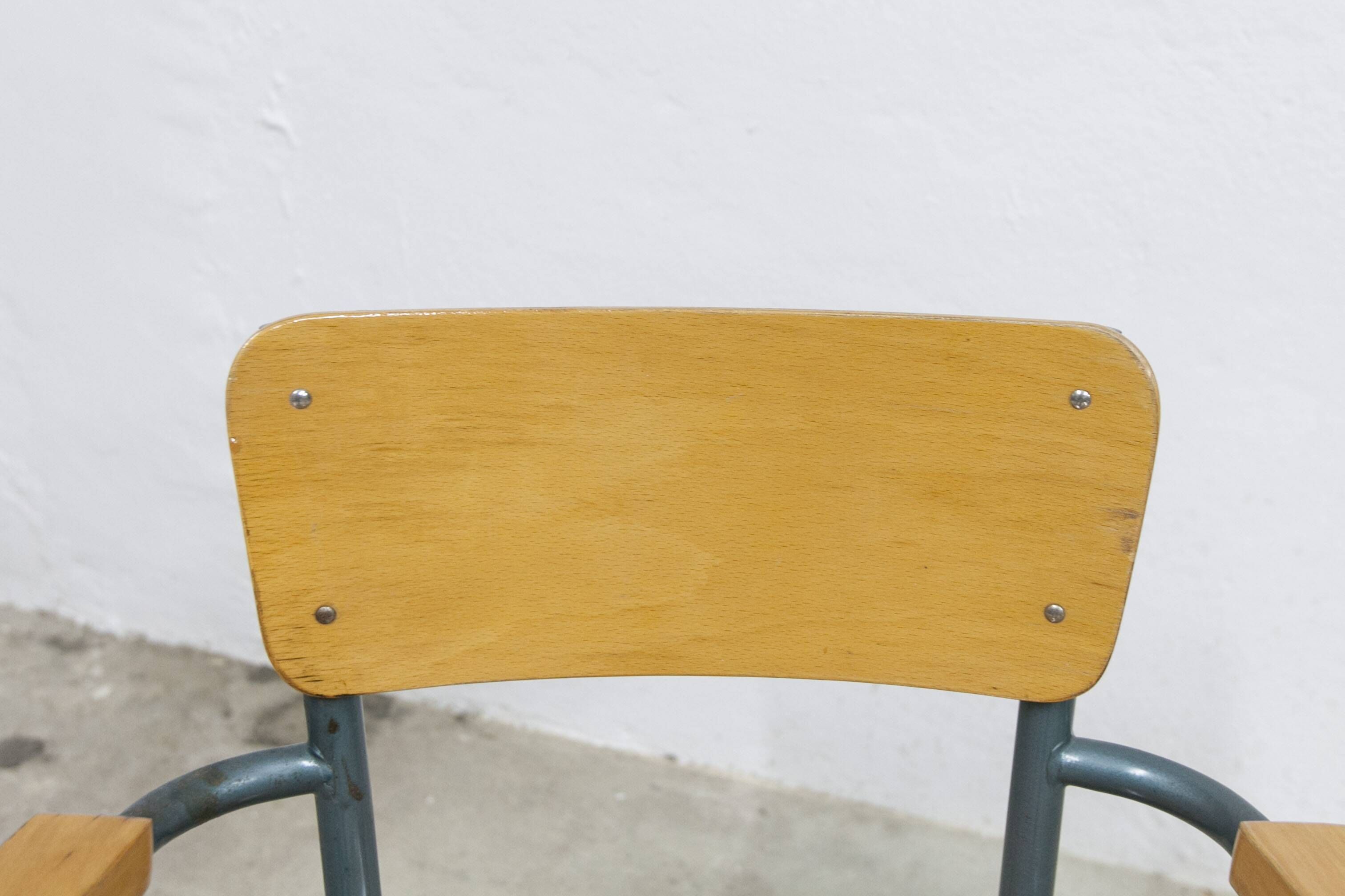 1962 school teacher's chair in honey color and tubular structure