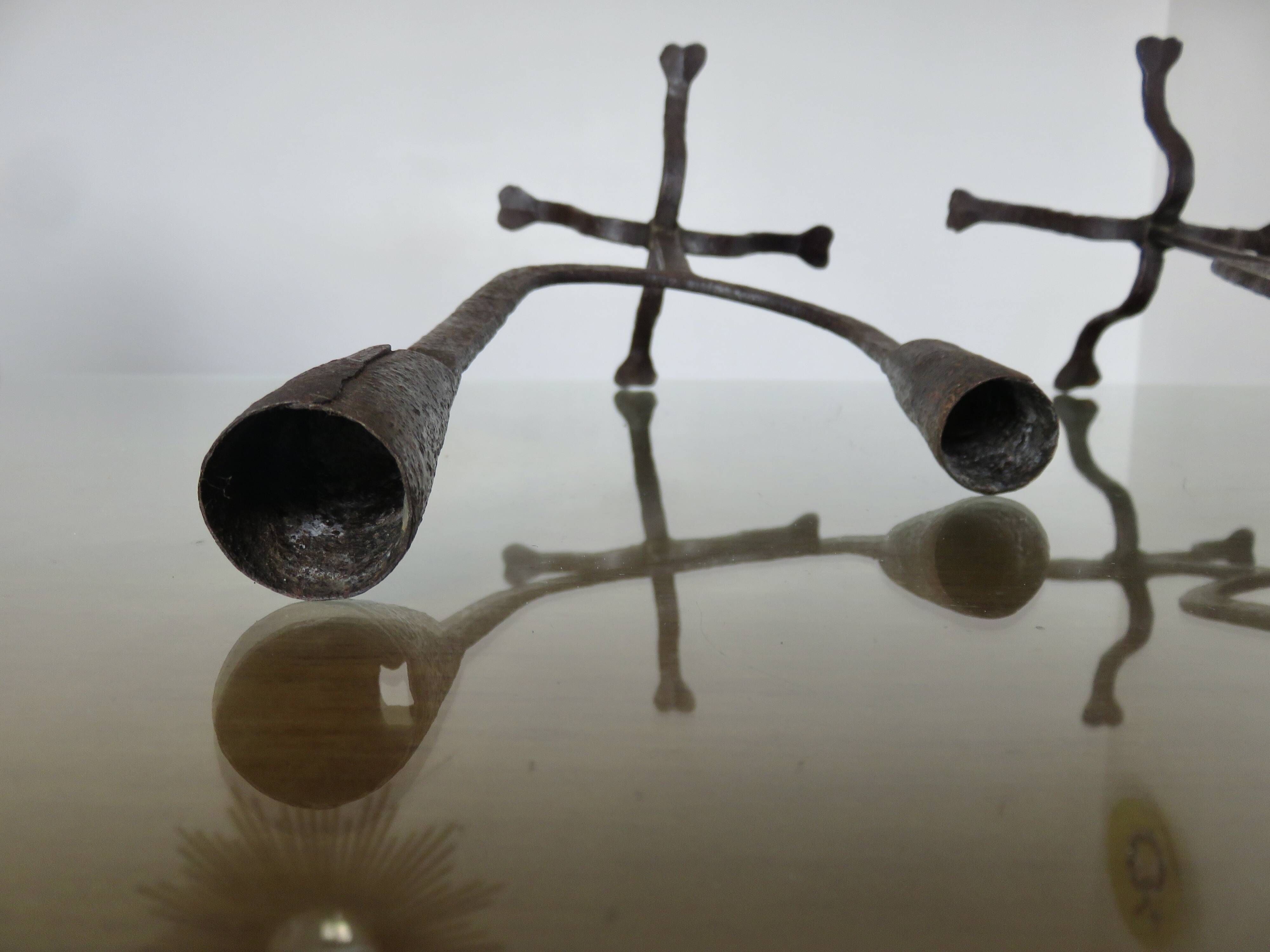 Pair of antique wrought iron candlesticks