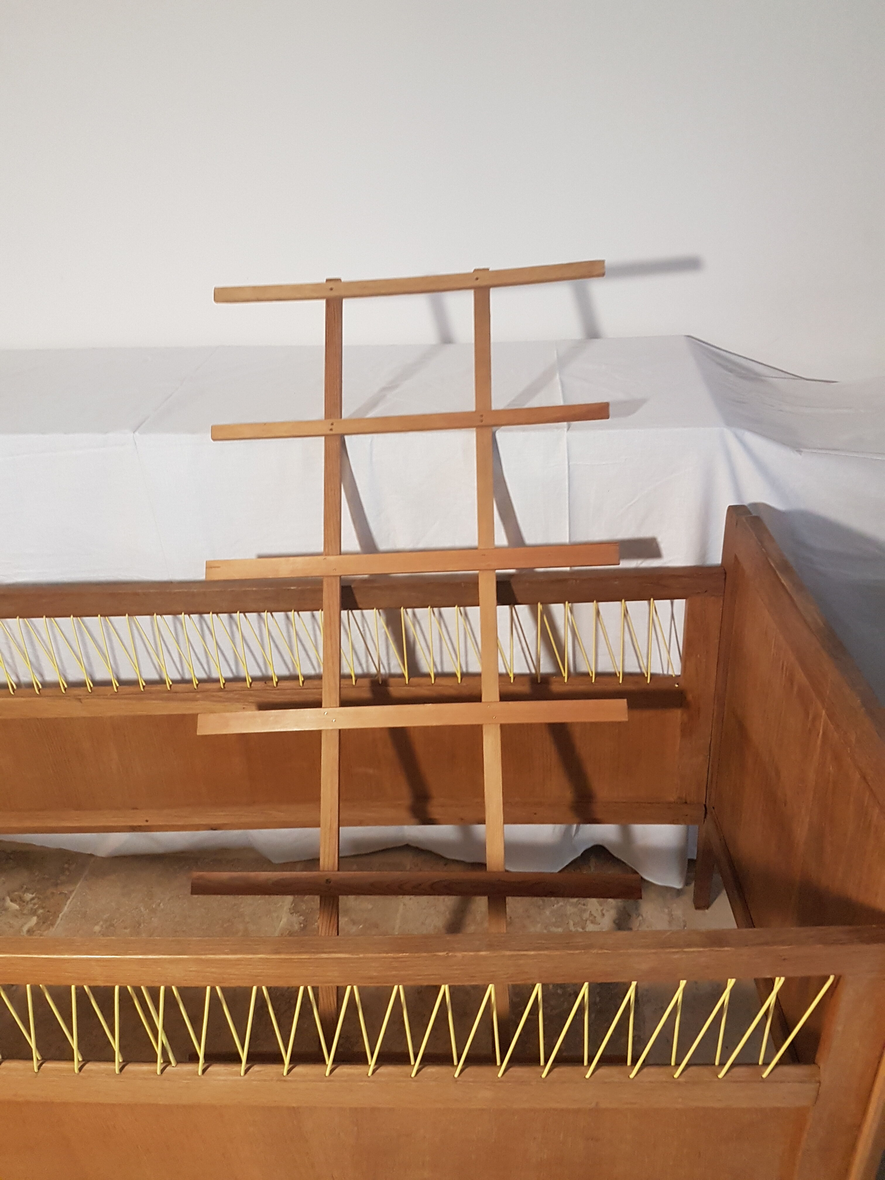 Children's bed made of wood and yellow scoubidou, 1950s.