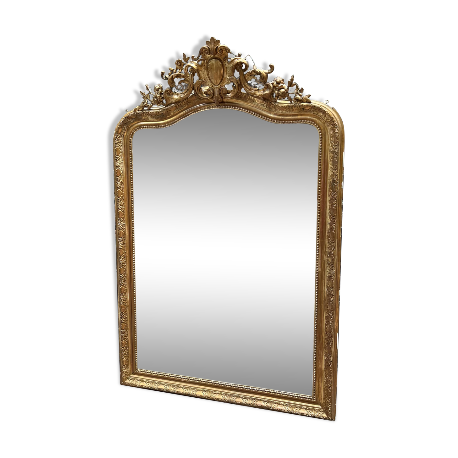 Louis XV style mirror in gilded wood and stucco, 20th century.