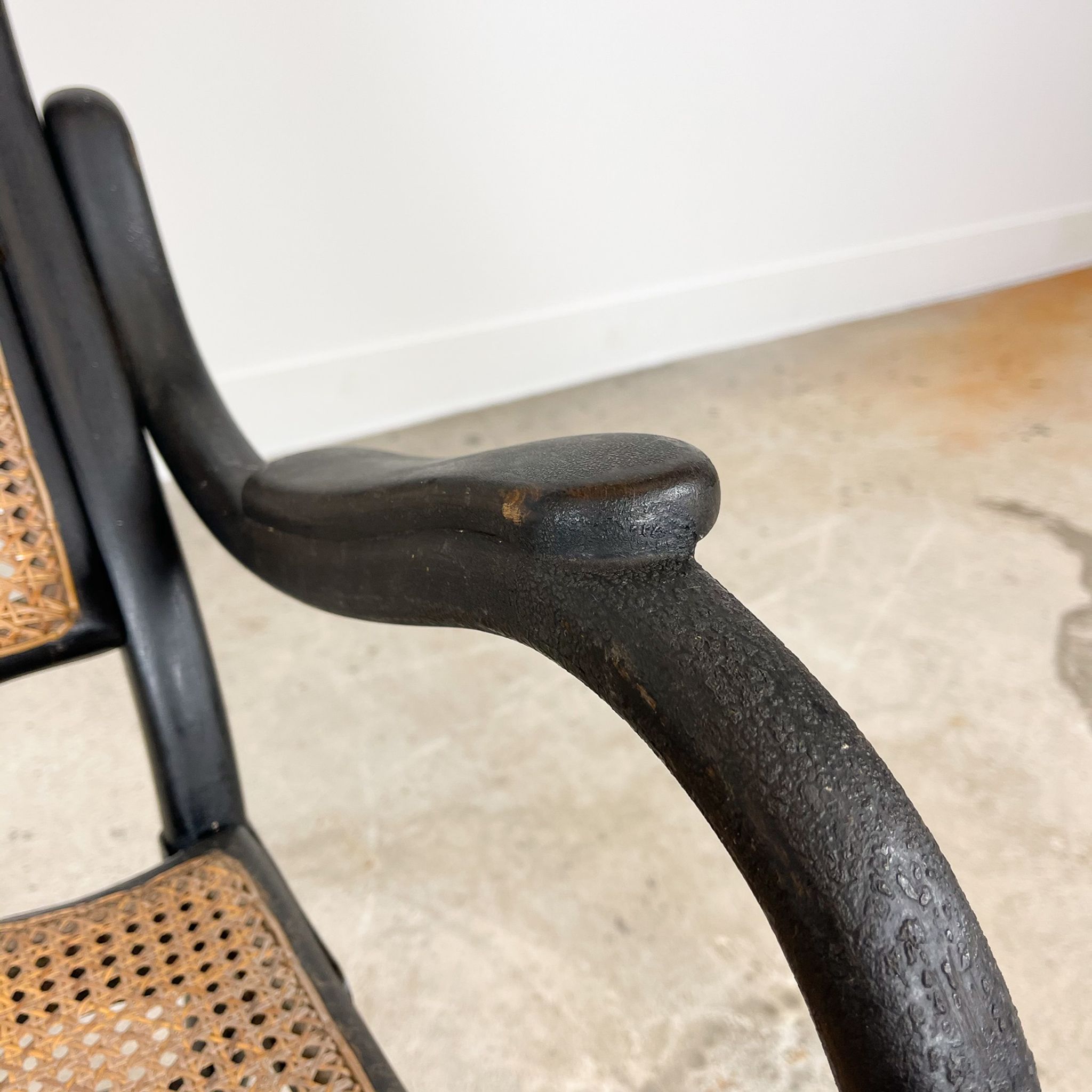 Antique black bentwood and cane lounge armchair by Thonet 19th century