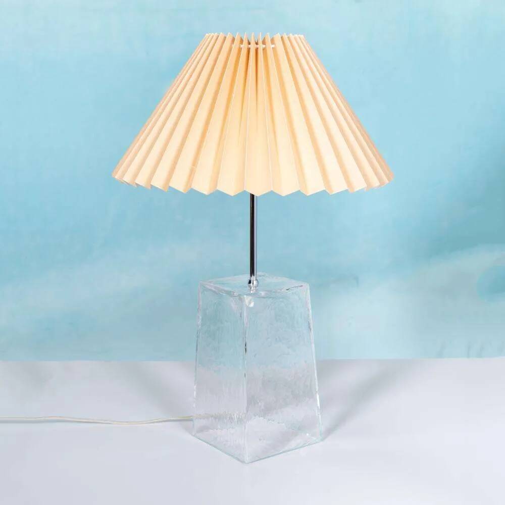 Minimalist glass table lamp from the 80s with a pleated shade.