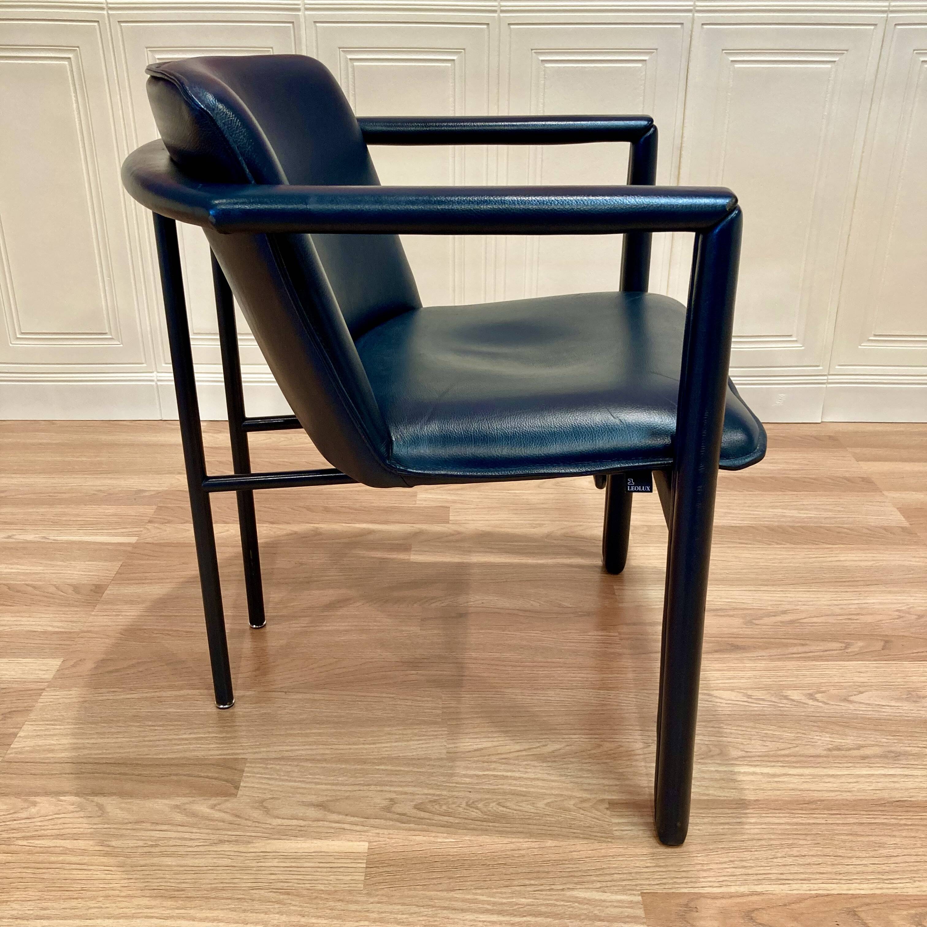 Design armchair in leather and metal.