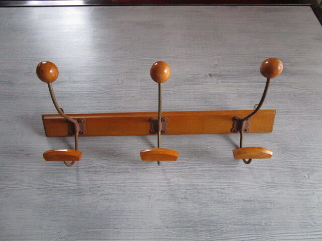 Old coat hangers in wood and metal
