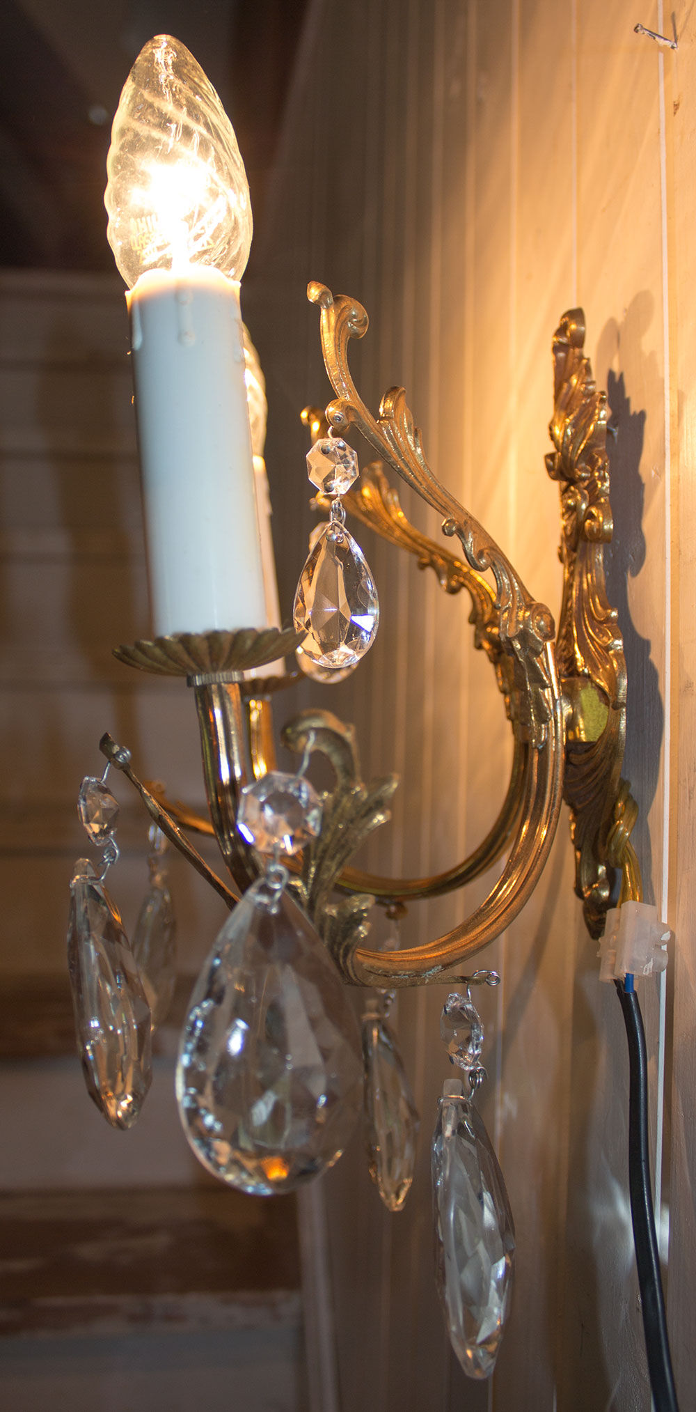 Old brass sconce with glass drops