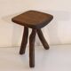 Patinated tripod stool in solid wood from the 1960s.