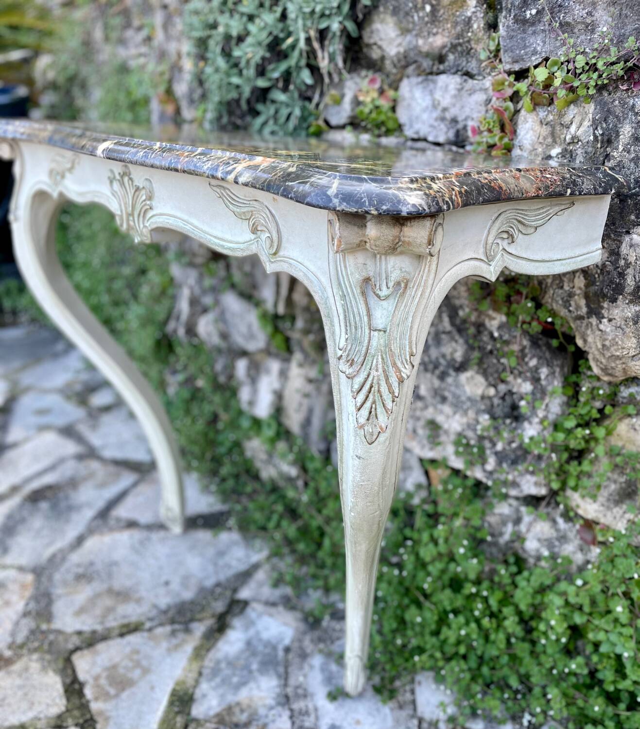 Wall console in painted, carved and molded wood in Louis XV style.