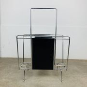 Chrome and black leather magazine rack, 1970s.