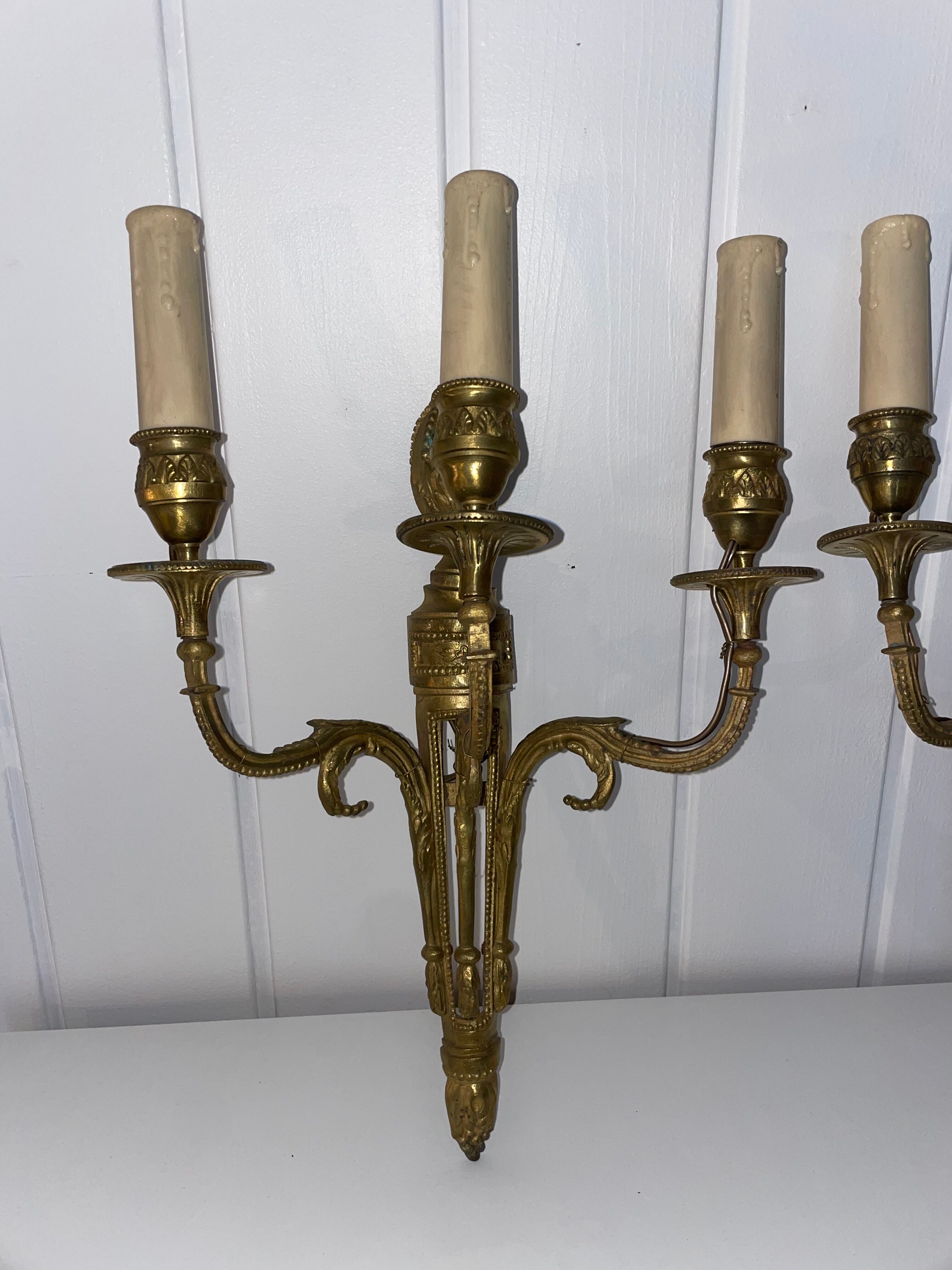 Pairs of Louis XVI bronze wall lamps