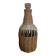 Bottle dressed in woven wicker