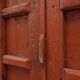 Large 17th century Monastery doors in terracotta lacquered oak, Portugal
