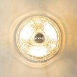 Sculptural wave wall lamp made of structured solid glass by peill & putzler