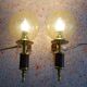 Golden wall lamps with round glass shades and teak veneer