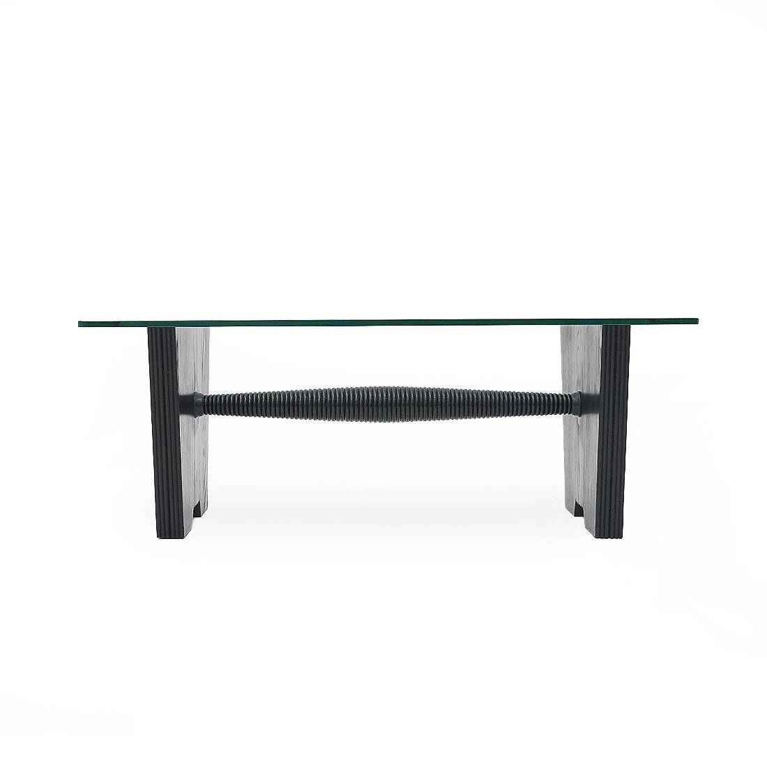 Coffee table with a glass top and black stained wood frame, 1930s.