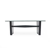 Coffee table with a glass top and black stained wood frame, 1930s.