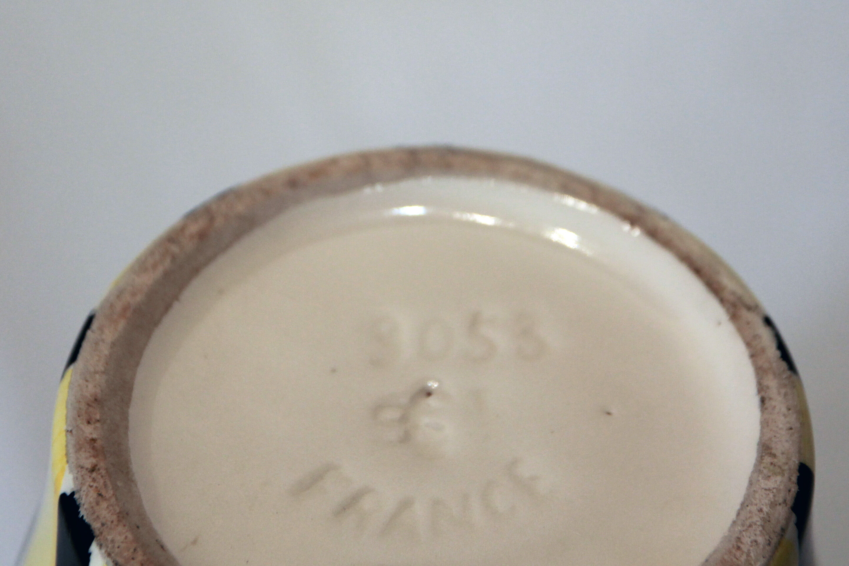 Yellow and black ceramic vase