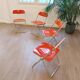Four red Plia chairs – Anonima Castelli