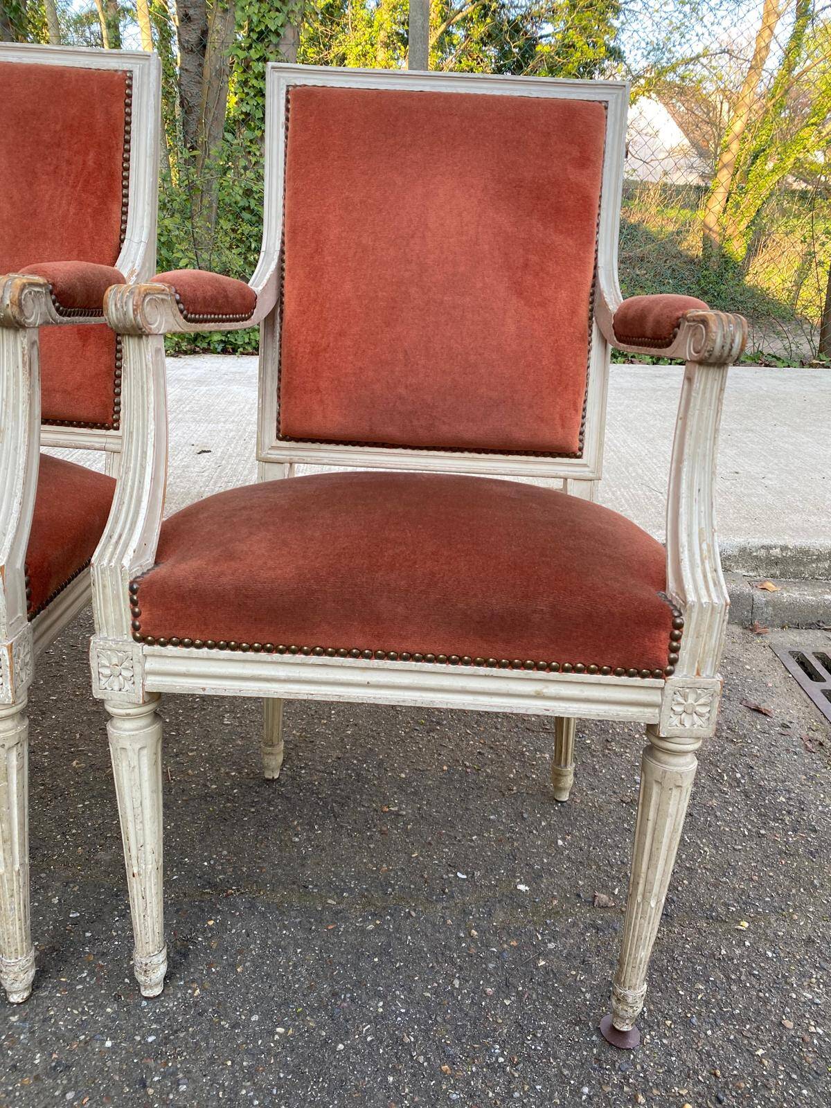 2 Louis XVI armchairs in solid wood and orange velvet.