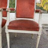 2 Louis XVI armchairs in solid wood and orange velvet.