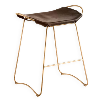 Contemporary kitchen stool in aged brass and dark brown leather.