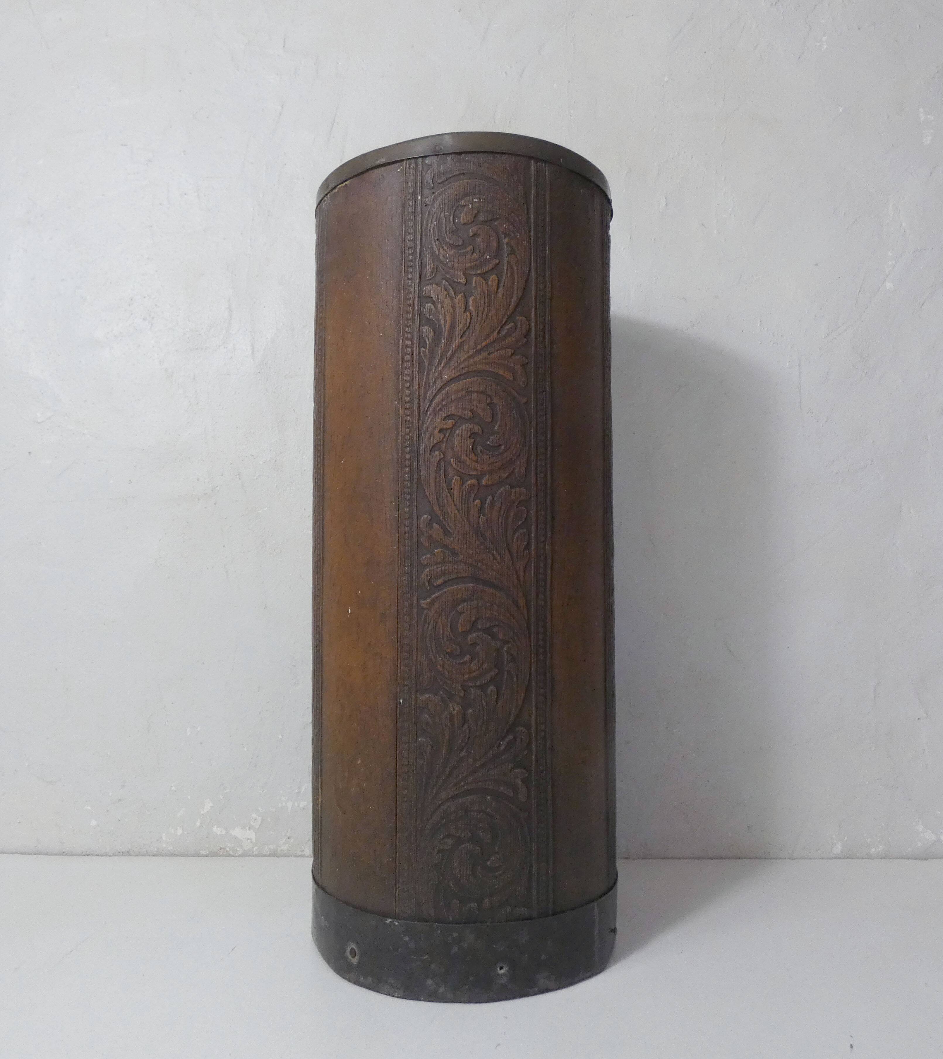 old carved wooden umbrella stand