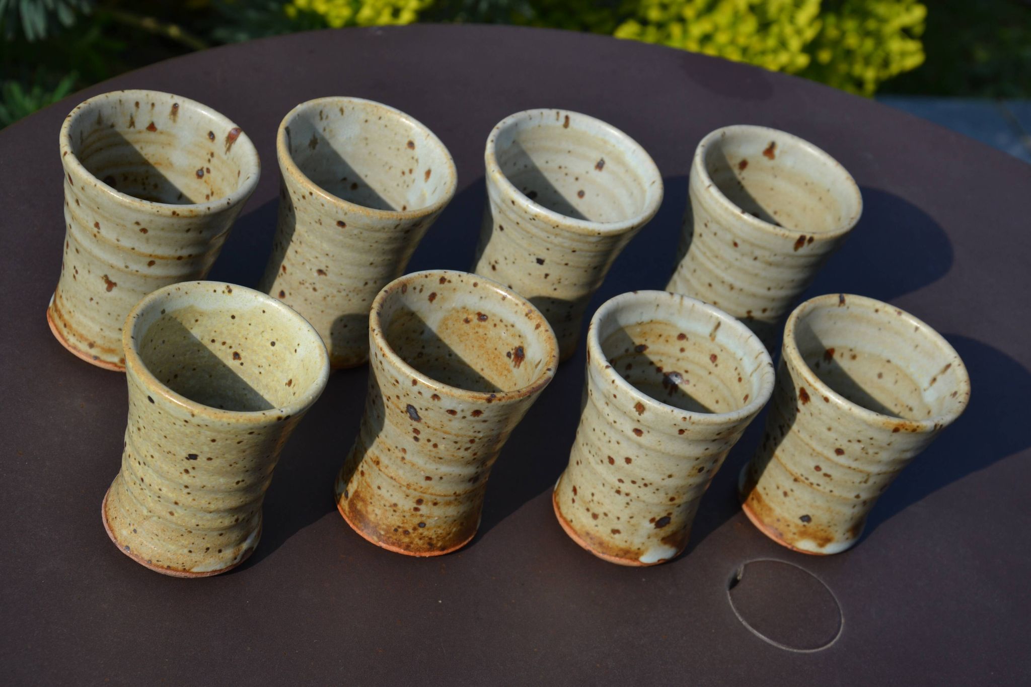 8 stoneware cups/mugs by Gustave Tiffoche