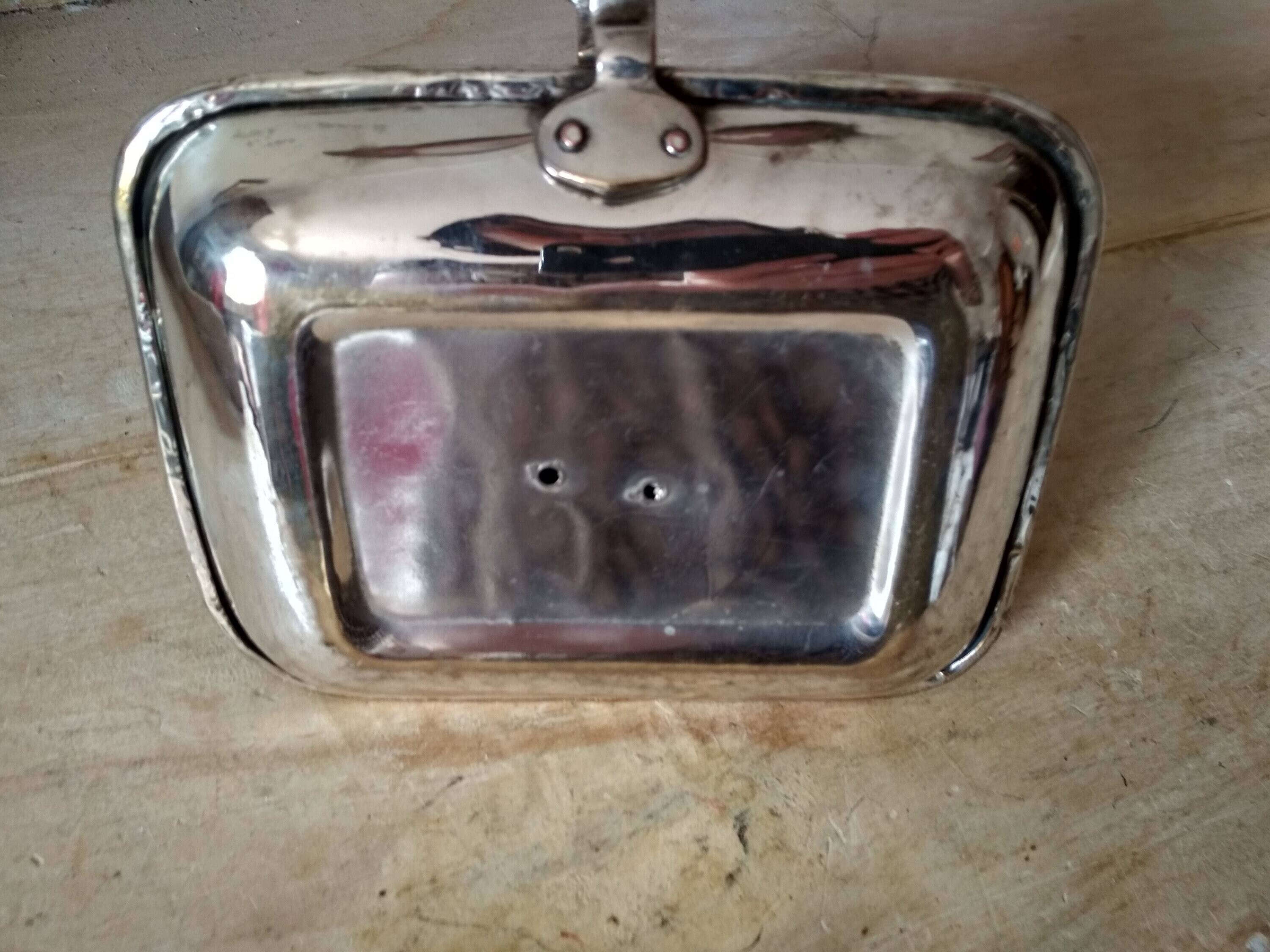 Antique metal and brass hand candle holder on rectangular base