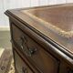 English mahogany pedestal desk with leather top from the 1950s
