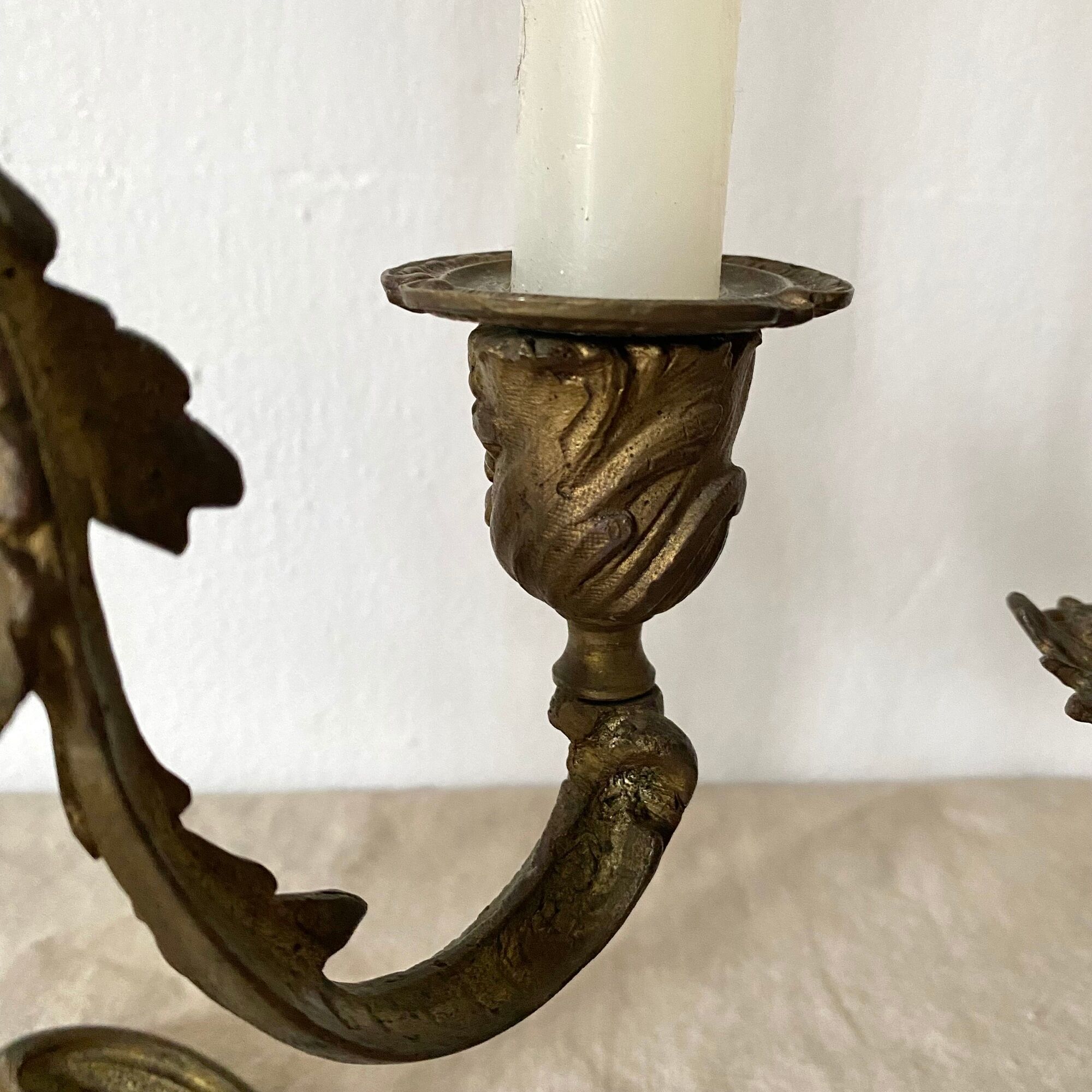 Pair of antique bronze candlesticks at the end of the table XIXth