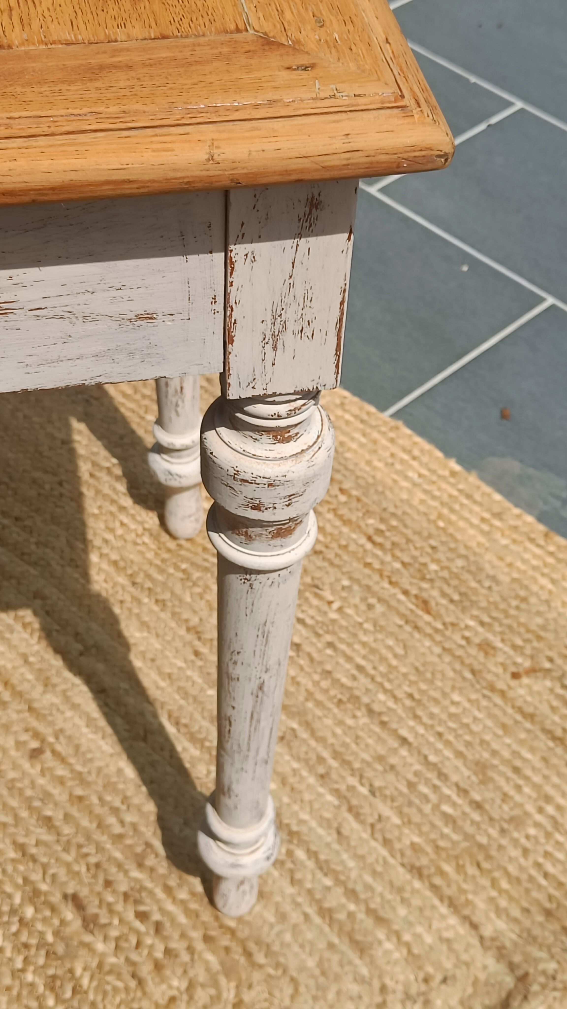 Antique drawer table with a patina.