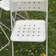 Set of 9 vintage perforated metal folding chairs from the 1970s-80s.