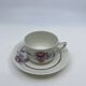 Porcelain coffee service with floral decoration and silver trim.
