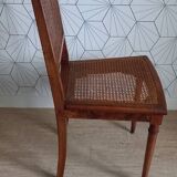 Chaise cannée art déco avec ornements en bronze.