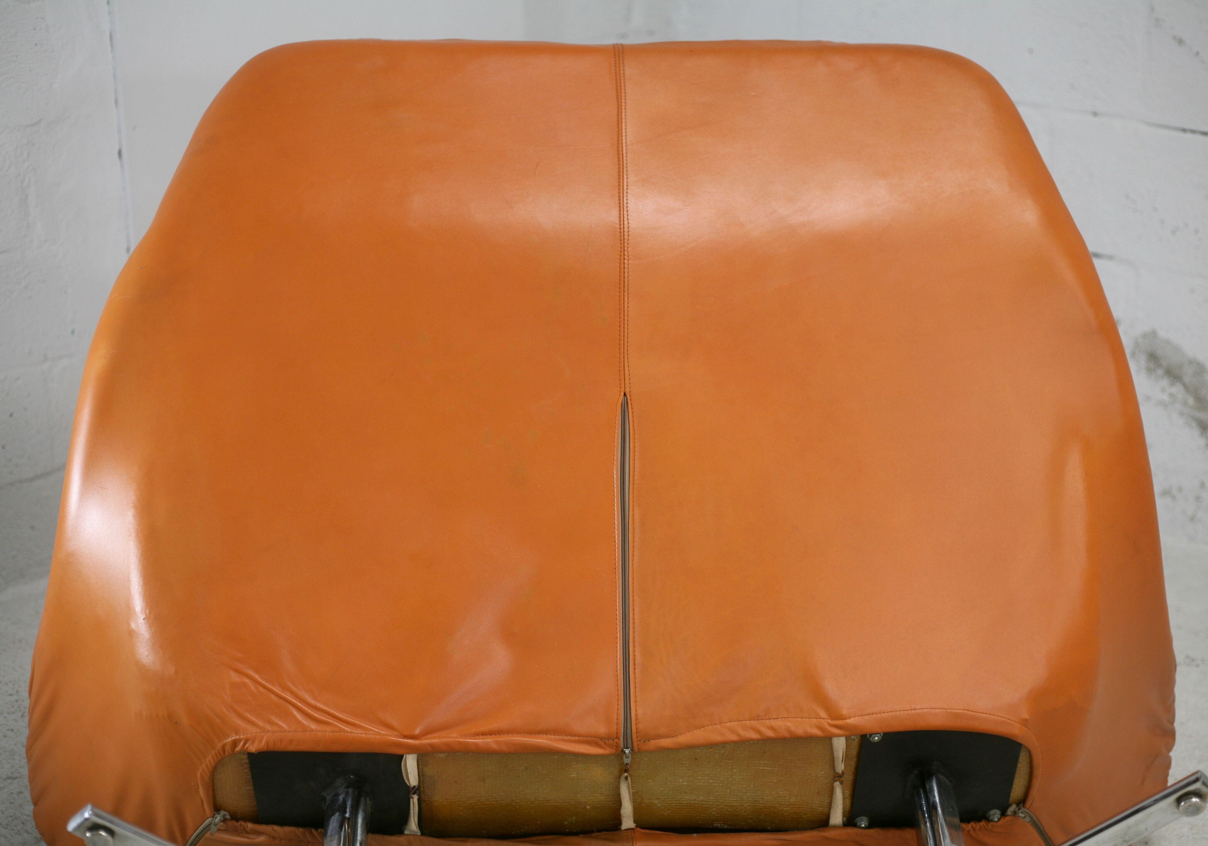 Sofa "space age". Leather, fiberglass, foam, steel. Circa 1970. Orange.