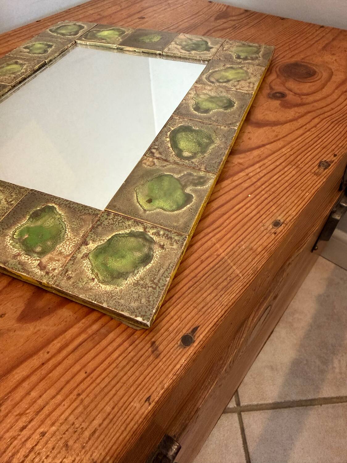Vintage 1960s green and brown glazed ceramic mirror.