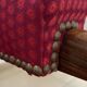Antique Louis Philippe armchair in walnut and red fabric.