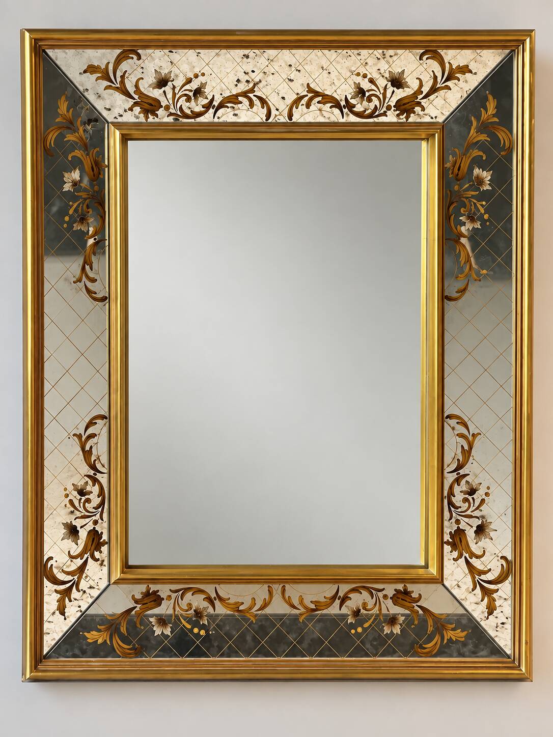 Large Venetian-style mirror with golden floral decoration.