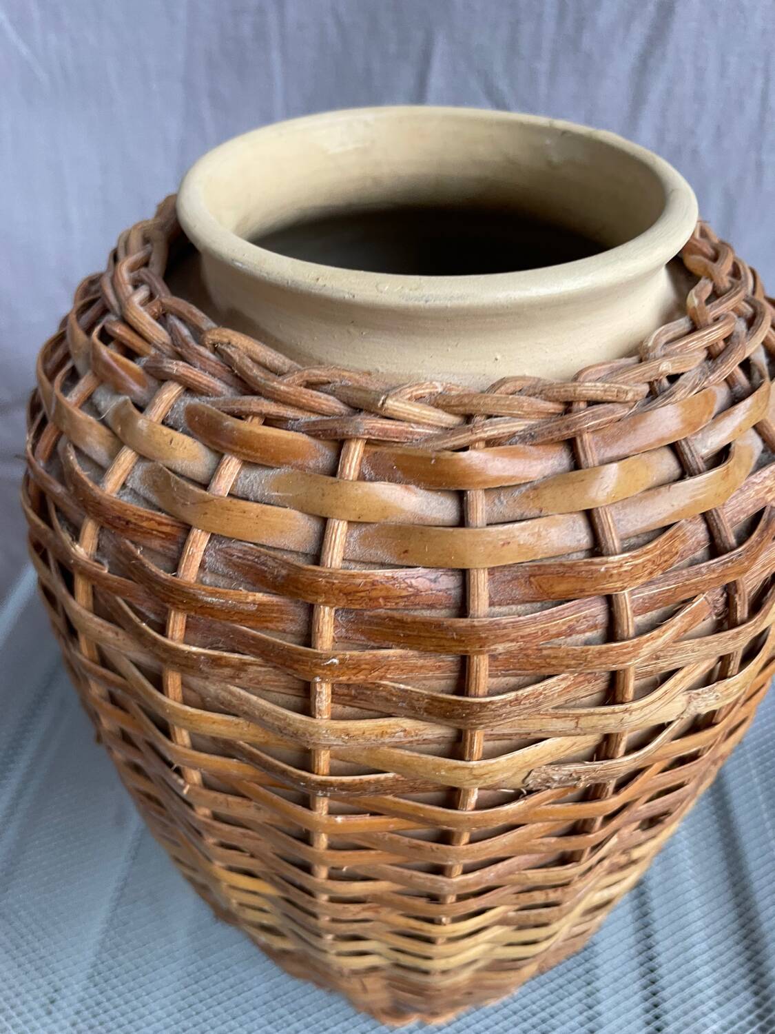 Vintage stoneware and rattan vase